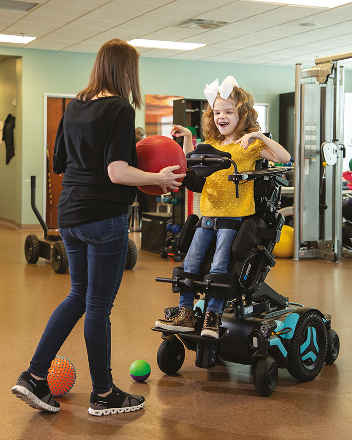 Young girl in MCorpus VS power wheelchair