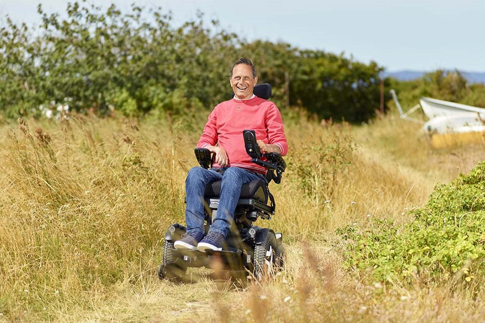 Man driving in F5 corpus power wheelchair